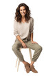 © Suplim - A woman in relaxed attire sitting on a stool Isolated