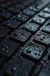 A close up of a keyboard covered in water droplets. Perfect for illustrating the concept of water damage or technology in a rainy environment