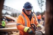 logger sharpening chainsaw blade at the job site