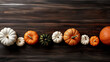 A group of pumpkins on a dark white color wood boards