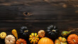 A group of pumpkins on a light black color wood boards