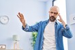 © Krakenimages.com - Young bald man suffering dizzy standing at home
