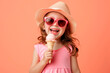 cute little girl having ice cream in studio