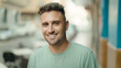 © Krakenimages.com - Young hispanic man smiling confident standing at street
