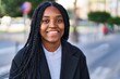 © Krakenimages.com - African american woman smiling confident standing at street