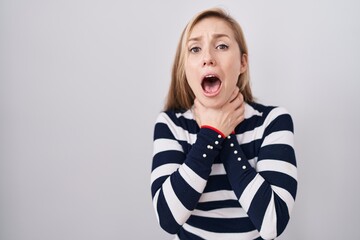 Sticker - Young caucasian woman wearing casual navy sweater shouting and suffocate because painful strangle. health problem. asphyxiate and suicide concept.