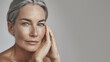 © Casther - Mature woman with flawless healthy skin and silver hairstyle in close-up portrait. Beauty cosmetics and anti-aging skincare concept