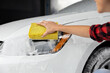 Close up of a womans hand cleaning the car