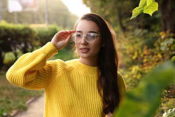 Sticker - Beautiful young woman in stylish warm sweater outdoors