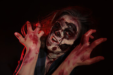 Wall Mural - Scary zombie on dark background. Halloween monster