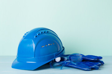 Blue construction equipment on wooden table