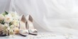 © Julia Jones - White wedding shoes and the bride's bouquet with a dedicated space for text