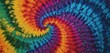  a multicolored tie - dyed background with a spiral design in the middle of the tie - dye pattern.