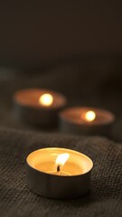 Wall Mural - Small candles in vertical format