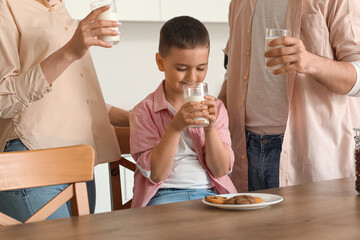 Sticker - Little boy with his parents drinking milk in kitchen