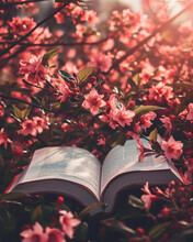 An Open Book Of Poetry Against A Backdrop Of Blooming Flowers