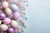 Fototapeta  - Easter eggs and gypsophila flowers, neatly arranged on a blue pastel background, copy space