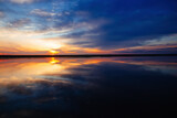 Fototapeta Zachód słońca - Sunset or dawn on sea