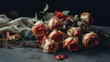 Bouquet of withered roses with their petals falling on a wooden table - copy space