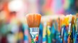 Closeup of a paintbrush covered in bright colors, symbolizing volunteering at a local art center or helping to beautify a community space.