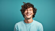 © FATHOM - Happy smiling young adult man on a solid background