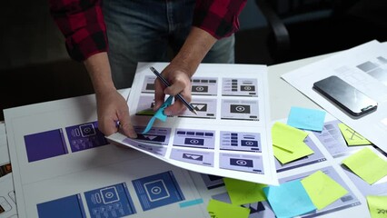 UX developers, UI designers think about designing creative mobile app interface layouts Application planning sketch Prototype development process with customer code and color code online business work