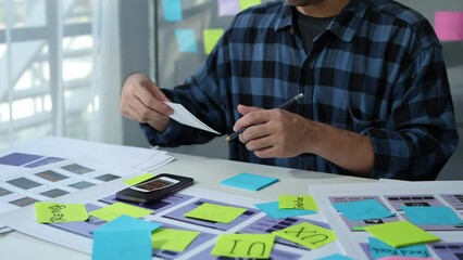 UX developers, UI designers think about designing creative mobile app interface layouts Application planning sketch Prototype development process with customer code and color code online business work