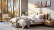 Beige bed and blanket next to stylish wooden wardrobe in elegant bedroom