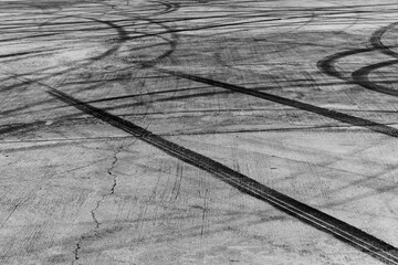 Sticker - Tire track mark on asphalt tarmac road race track texture and background, Abstract background black tire tracks skid on asphalt road in racing circuit, Tire mark skid mark on asphalt road.