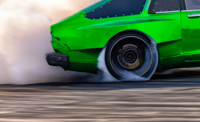 Wall Mural - Blurred car drifting diffusion race drift car with lots of smoke from burning tires on speed track, Professional driver drifting car on race track with smoke.
