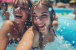 Laughing young women enjoying an aqua park