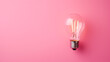 © alionaprof - Light bulb on pink background, top view. Creative idea concept
