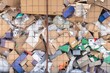 Cardboard waste pile stacked on a landfill