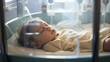 Newborn baby sleeping in the incubator