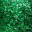 Green sparkle glitter background. Glittering sequins wall.
