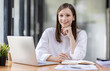 © David - Young business hispanic woman work on laptop desk doing math finance on an office desk, tax, report, accounting, statistics, and analytical research concept