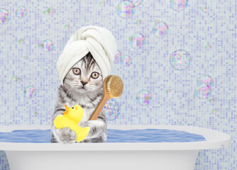 Aufkleber - Cute kitten with towel on it head takes the bath at home with rubber duck and shower brush. Empty space for text