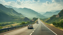 Scenic Highway With Car Driving Through Lush Green Mountains On A Sunny Day, Showcasing Natural Beauty And Travel Concept.