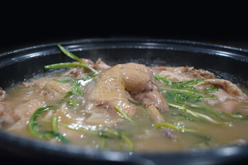 Traditional Korean food where chicken is stuffed with herbal medicine and rice and boiled whole