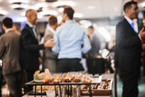 Fototapeta  - Blurred image of businesspeople at banquet event business meeting event. Business and entrepreneurship events concept. Focused on the canapes.