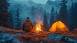 Camping trip in the highlands at night, under the stars. Male adventurer relaxes by a bonfire and his tent snuggled among the woodland.