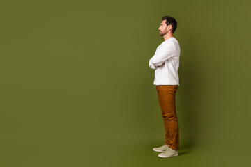 Sticker - Profile side full length photo of successful man wear trendy clothes watching billboard empty space isolated on khaki color background