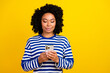© deagreez - Photo of lovely cute girl wear stylish clothes use modern device apple iphone modern device isolated yellow color background
