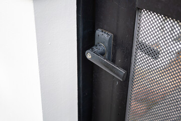 Wall Mural - Metal door knob handle with key hole of the residential house doorway. Close-up and selective focus.