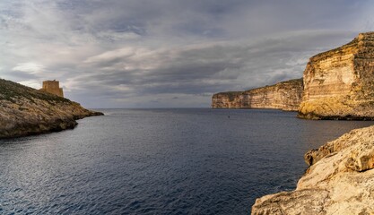 Poster - view of the Xlendi Bay watchtower and cliffs on the coast of Gozo Island in Malta