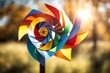 A homemade pinwheel spinning in the wind, with a blurred background of a sunny day.