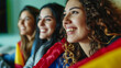 Excited Young Spanish Women Soccer Fans Watching European Tournament Match on TV, Expressing Joyful Celebration and Support