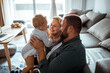 © Davor - Happy family with baby enjoying time together at home