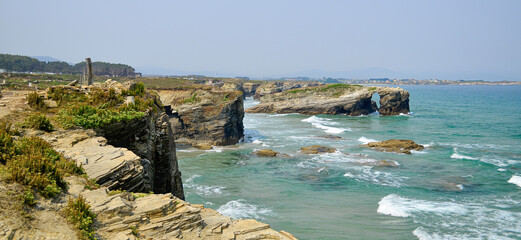 Las Catedrales beach is the tourist name for Aguas Santas beach, located in the Galician municipality of Ribadeo, on the coast of the province of Lugo, Spain, on the Cantabrian Sea.
