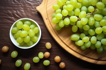 Wall Mural - Fresh green grapes in wooden bowl